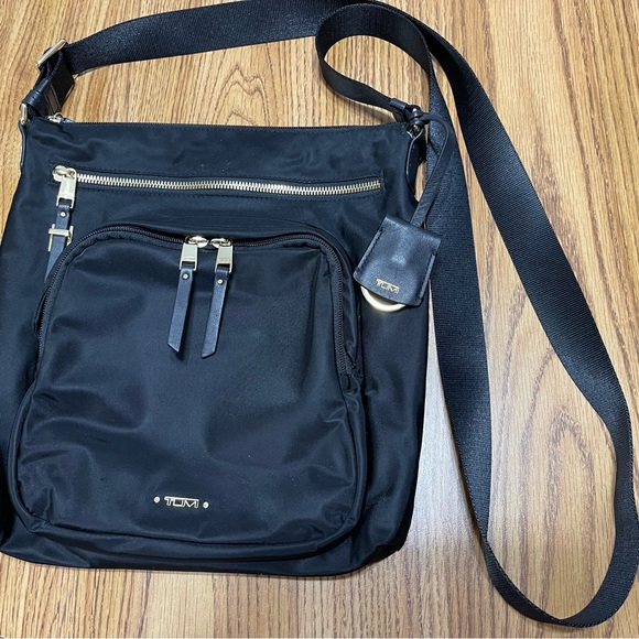 Tumi Bags Tumi Voyageur Carmel Crossbody Black Poshmark